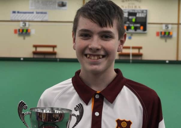 Northampton & District IBCs Thomas Manderson with his Northants Bowls Youth Development Scheme Junior Section title trophy