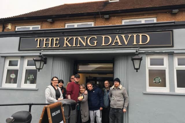 Sarah Powell (left) and son Harry (red jumper) outside the King David with their customers
