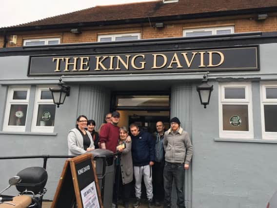 Sarah Powell (left) and son Harry (red jumper) outside the King David with their customers