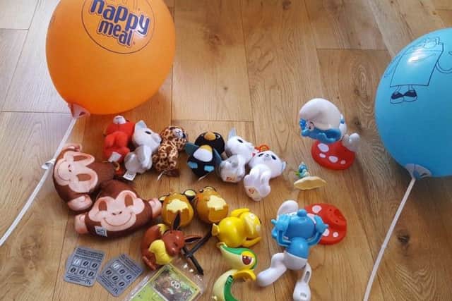 The family are selling McDonald's Happy Meal toys to help pay the fine