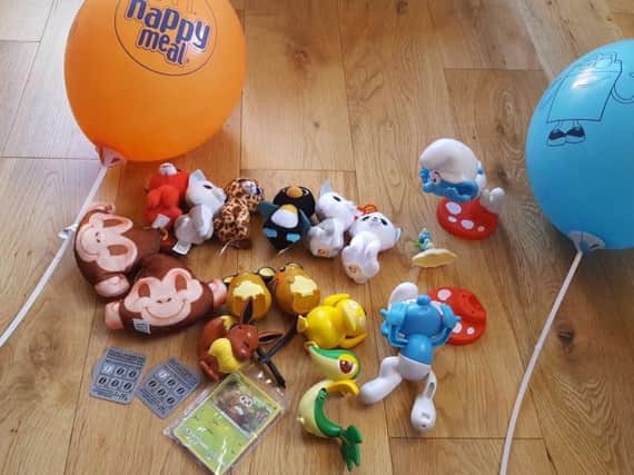 The family are selling McDonald's Happy Meal toys to help pay the fine