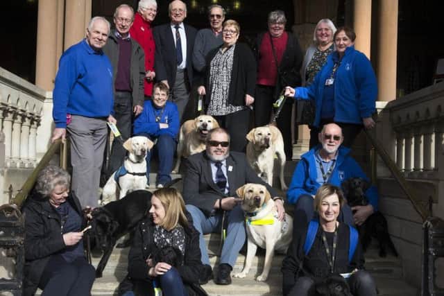 Councillor Christopher Malpas, centre, raised a record-breaking 61,000 for the Guide Dogs Association through his mayor's fund.