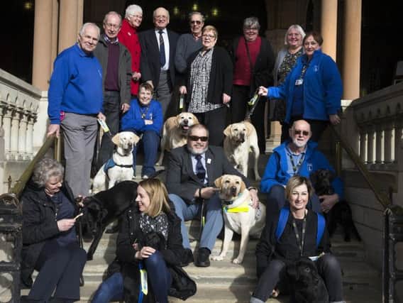 Councillor Christopher Malpas, centre, raised a record-breaking 61,000 for the Guide Dogs Association through his mayor's fund.