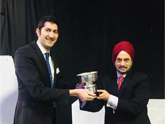 Dr Rufai is pictured receiving the award from Professor Harminder Dua, chair of the Nottingham Eye Symposium at the 22ndNottingham Eye Symposium and Research Meeting inJanuary 2018.