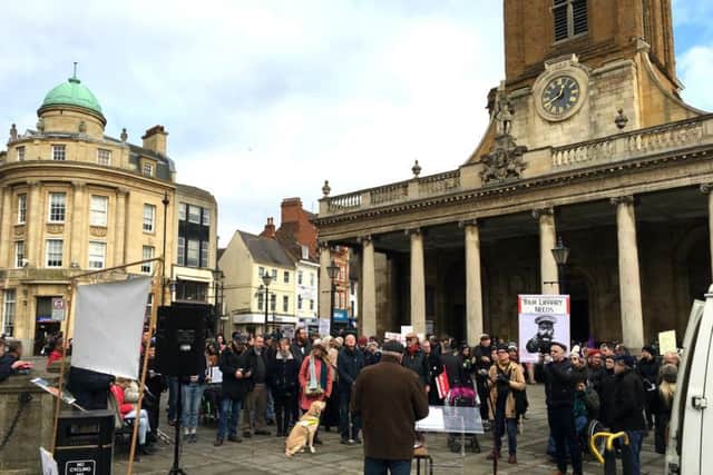 Around 80 people gathered outside All Saints Church on Saturday for the anti-cuts rally
