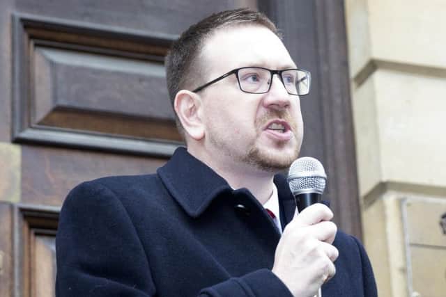 Andrew Gwynne speaking outside of County Hall.