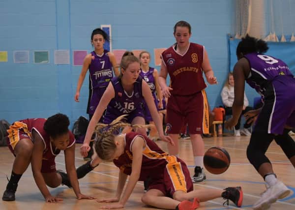 GRAB THE BALL! - action from Northants Lightning Under-16 Girls' heavy defeat to Northamptonshire Titans (Pictures: Dave Ikin)