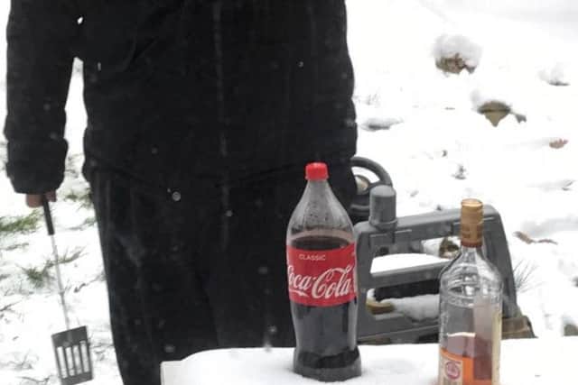 James made use of the snow and chilled his rum and coke outdoors.