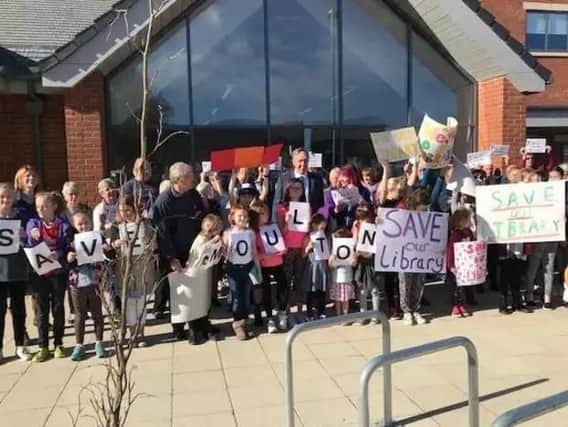 Protesters, in November last year, stood side-by-side in a bid to keep their beloved library open