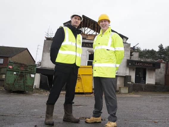 Chief executive of Northampton Partnership Homes (NPH) Mike Kay and project manager for the Tanners demolition William Jacobs pictured outside the decaying pub yesterday.