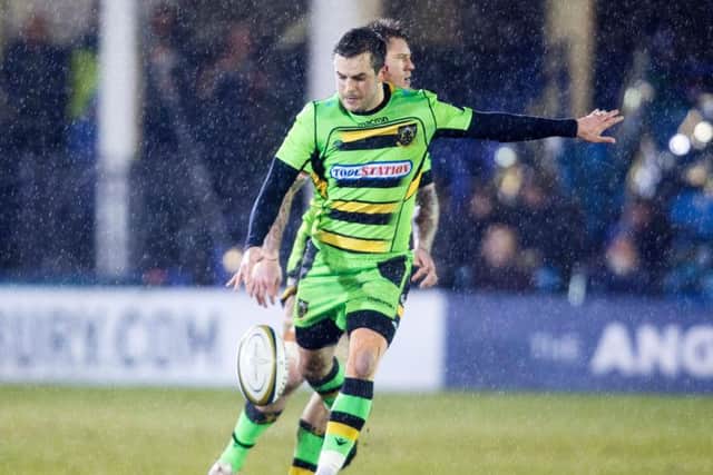 Stephen Myler kicks for position