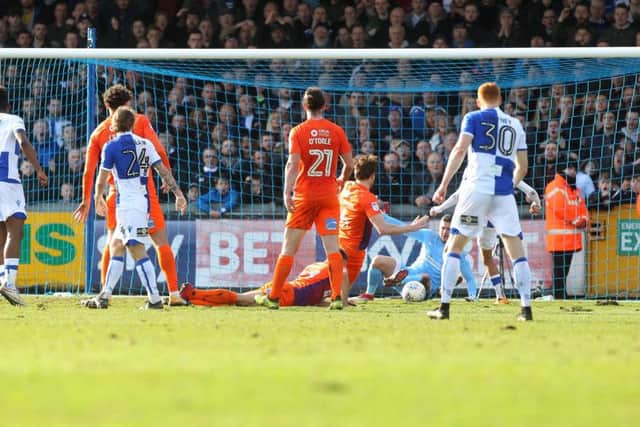 Kyle Bennett lifts over Richard O'Donnell to gives Rovers the lead against Northampton on Saturday. Pictures: Sharon Lucey