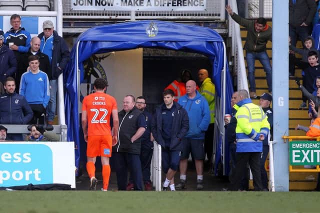 Matt Crooks trudges off after his red card and now faces a three-game ban. Pictures: Sharon Lucey