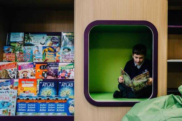 A pupil enjoys the new library.
