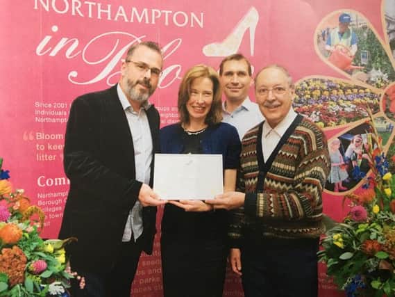 Pictured (left) chair of St James residents' association Graham Croucher with the librarian for St James and Roy on the far right after winning gold in the Northampton Britain in Bloom contest in 2015.