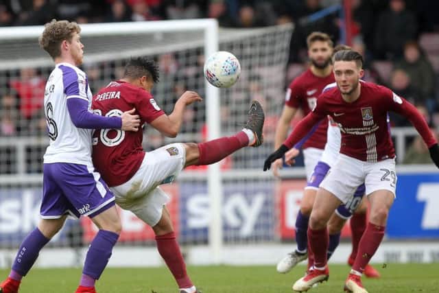 Action from the Cobblers' 3-0 defeat too Rotherham