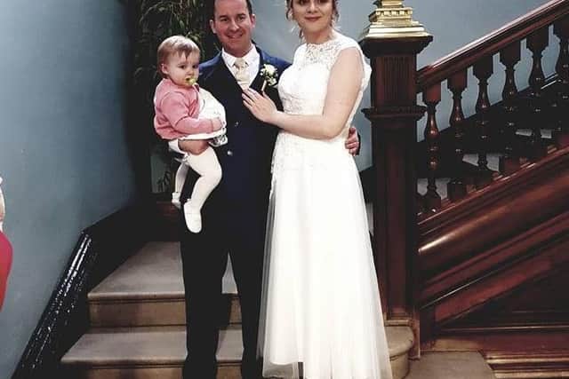 Rory, Louise and baby Emilie after the service in Wales.