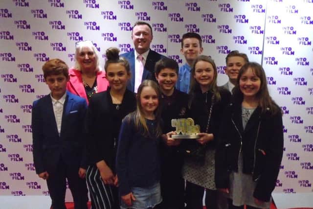 The children having their official photo taken after the award ceremony.