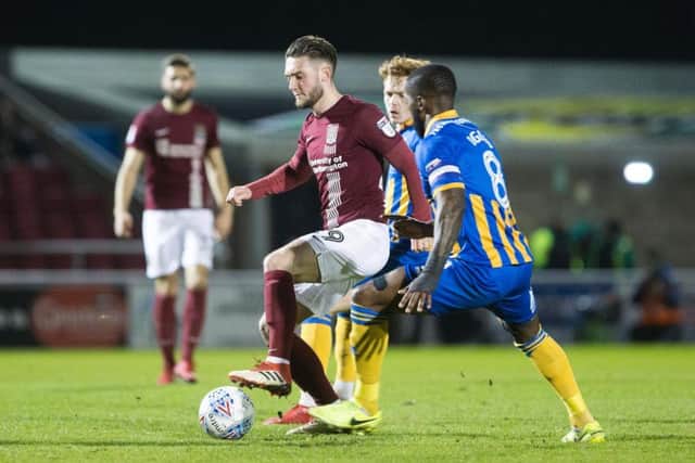 Matt Grimes on the ball