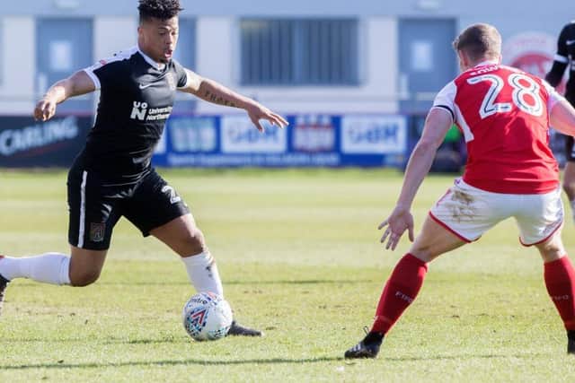 Hildeberto Pereira looks to take on Fleetwood's Jack Sowerby in the first-half of Saturday's contest. Pictures: Kirsty Edmonds