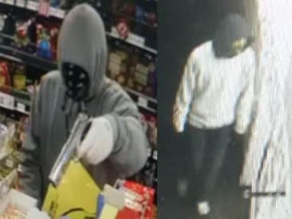 The men entered the shop wearing ski masks and carrying a gun.