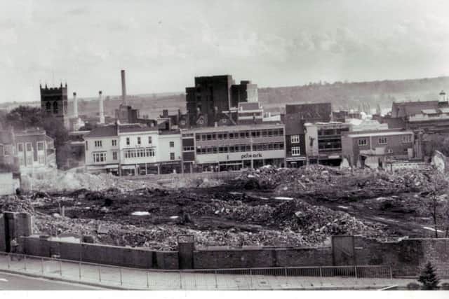 The former school used to dominate Northampton town centre, as shown here after it was demolished. Abington Street, as it was in 1979, can be seen beyond the wreckage.