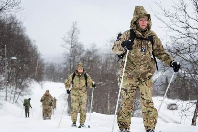 A group of reservists climb towards their training area in Rjukan, Norway