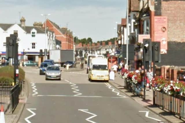 The woman's miniature Yorkshire Terrier was attacked by an American Bulldog cross in St James Road.