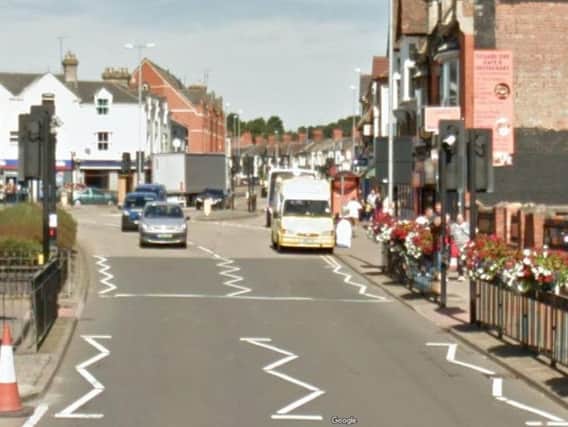 The woman's miniature Yorkshire Terrier was attacked by an American Bulldog cross in St James Road.