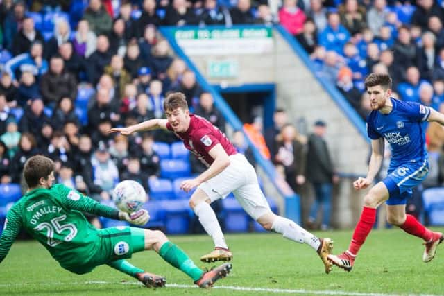 COSTLY MISS: Chris Long was denied by Posh goalkeeper Conor O'Malley in the early stages of Monday's clash at the ABAX Stadium. Pictures: Kirsty Edmonds