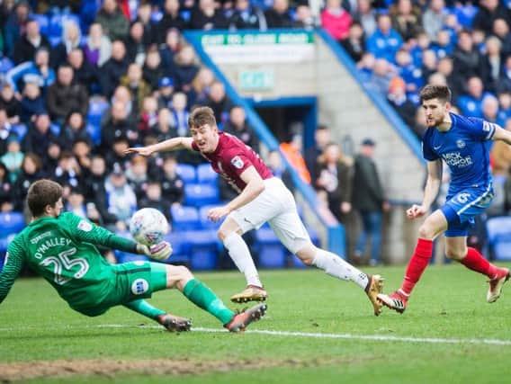 COSTLY MISS: Chris Long was denied by Posh goalkeeper Conor O'Malley in the early stages of Monday's clash at the ABAX Stadium. Pictures: Kirsty Edmonds