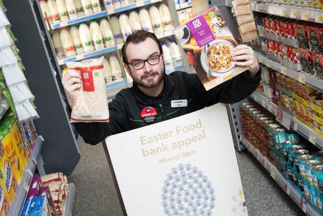 Co-op worker Shane Lewis was all smiles after customers and members in Northamptonshire helped collect more than 25,000 items as part of the Easter food bank appeal