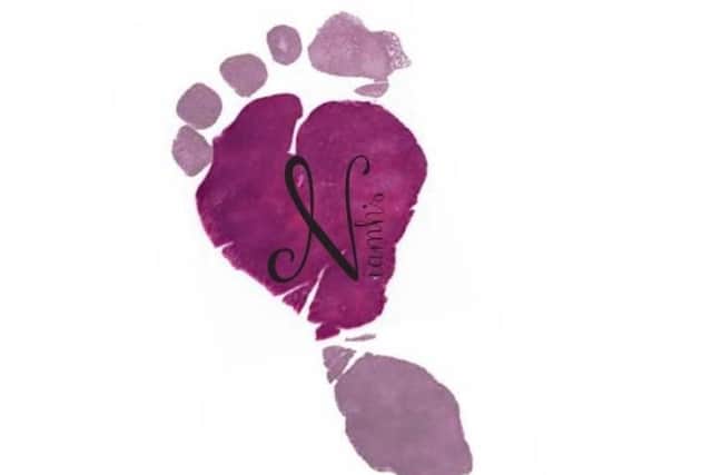 The Niamh's Legacy heart badge is Rob's daughter's footprint, who he lost four days before she was due.