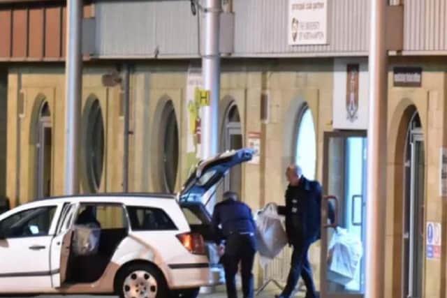 Police officers removing files from Sixfields in November, 2015. Since a civil battle was launched two-and-a-half years ago, no funds have been recovered.