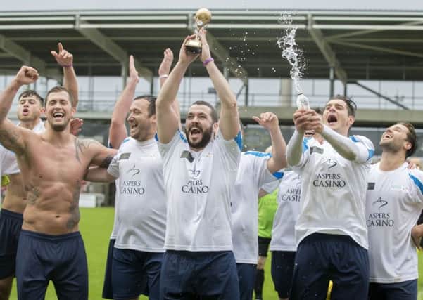 Winning captain lifts Shayne Ward the Niamh's Next Step charity trophy