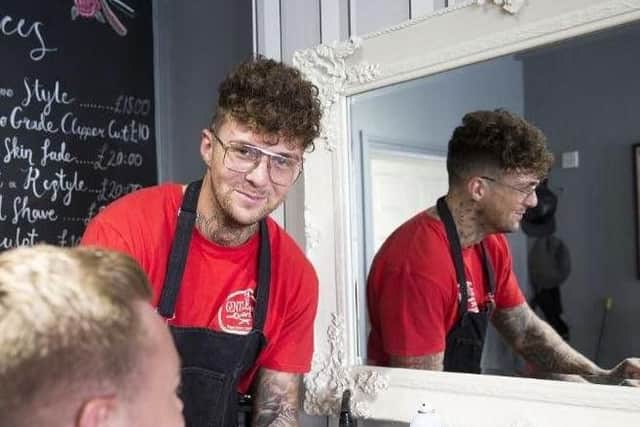 Barbershop owner Jake Hillery says he wants to give something back to the community by offering free haircuts to the homeless.