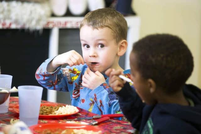 Children tucked in spaghetti bolognese for lunch yesterday (April 17).