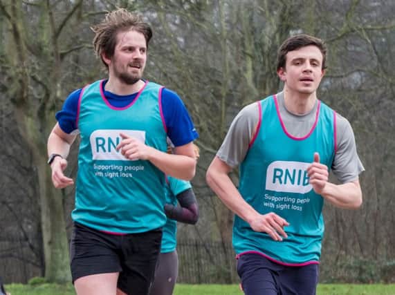 Pictured L-R: Mathew with his brother Huw, who will be Mathew's guide runner on Sunday.