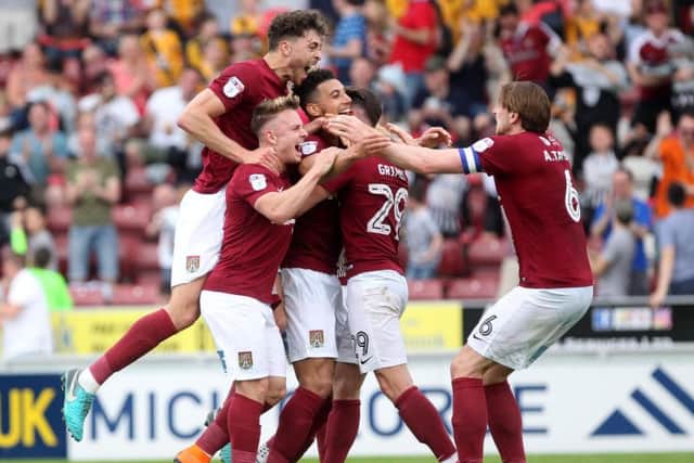 GET IN THERE! - the Cobblers players celebrate their second goal against Plymouth (Pictures: Sharon Lucey)