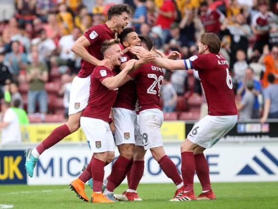 GET IN THERE! - the Cobblers players celebrate their second goal against Plymouth (Pictures: Sharon Lucey)