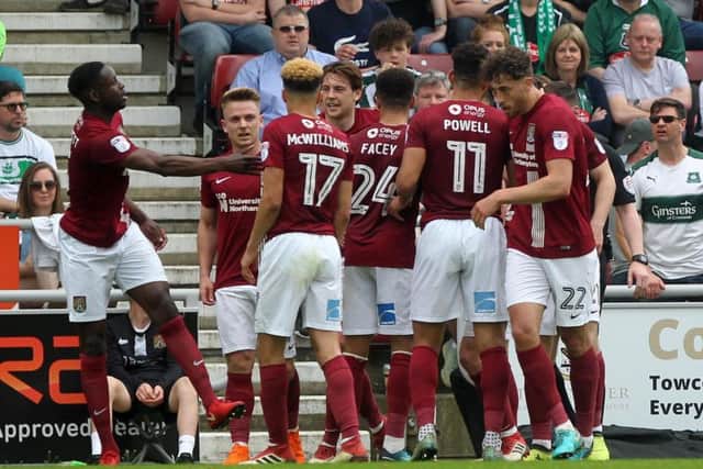 The Cobblers players celebrate John-Joe O'Toole's opening goal