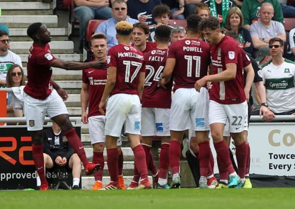 TEAM SPIRIT - the Cobblers players celebrate John-Joe O'Toole's goal n the win over Plymouth last weekend
