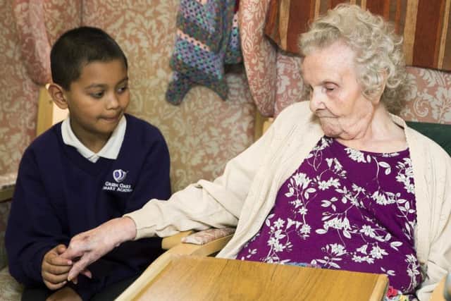 Zakaria Islam with Norah Finney (97).
