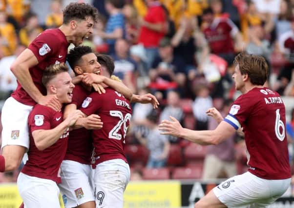 HAPPY LADS - the Cobblers players celebrate the second goal against Plymouth last weekend
