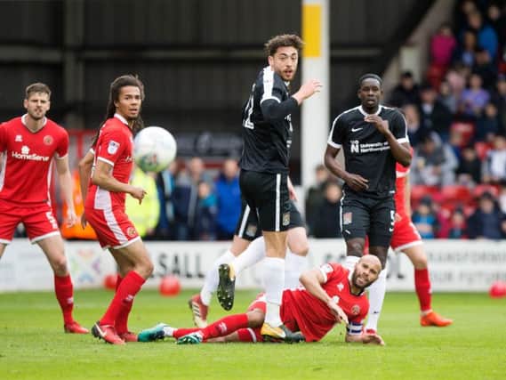 Matt Crooks battles for the ball in the Cobblers' defeat at Walsall (Pictures: Kirsty Edmonds)