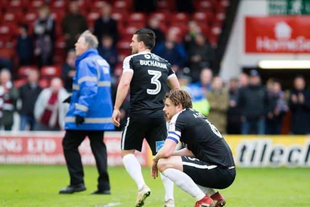 CRESTFALLEN: Ash Taylor and David Buchanan were left devastated at the full-time whistle. Pictures: Kirsty Edmonds