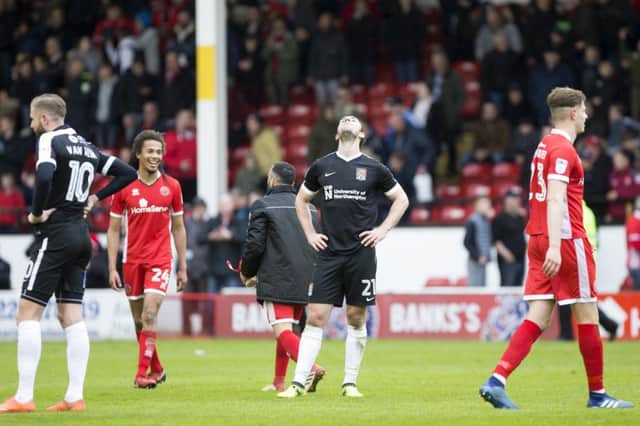 CRUSHING: It was a devastating way for the Cobblers to effectively be relegated, beaten by a last-minute winner against Walsall. Pictures: Kirsty Edmonds