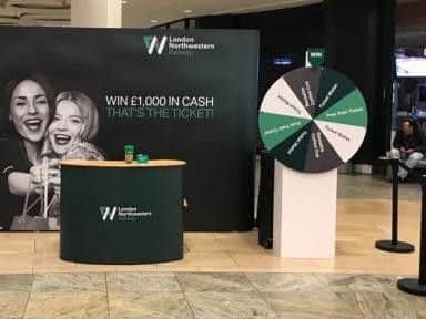 Shoppers who spin the London Northwestern Railway wheel could pick up travel freebies.