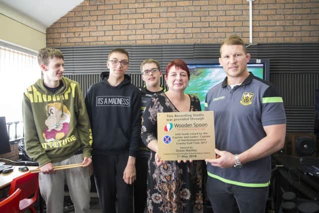 Dylan Hartley opens the new media suitw at the Bee Hive alongside headteacher Sheralee Webb and students