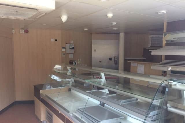 The shop shelves have been cleared and the till and fridge have gone.